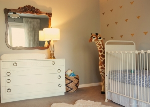 Natural eclectic nursery with dresser and mirror