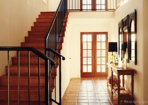 Spanish modern entryway foyer and staircase with console table