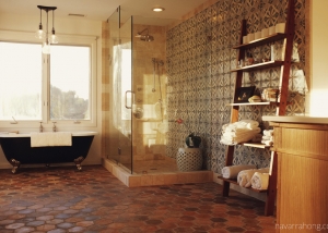 Spanish modern bath - Shower and clawfoot tub with wooden shelf and Spanish floor and wall tile