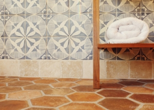 Spanish modern bath - Closeup painted wall tile and hexagon Spanish clay floor tile