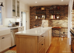 Contemporary rustic kitchen with brick wall and white quartz countertops