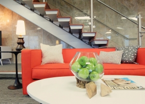 Mid-century modern agency lounge seating area closeup with couch in front of stairway